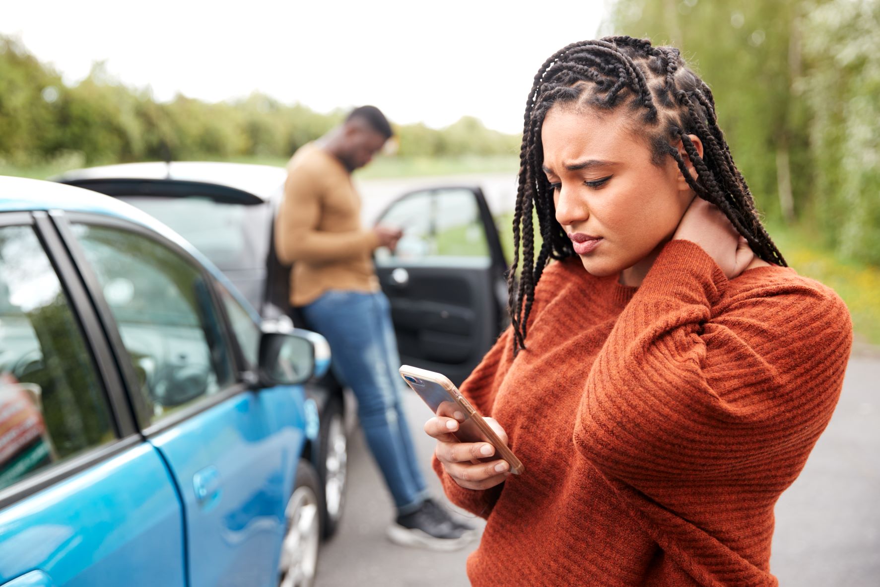 female-motorist-involved-in-car-accident-calling-i