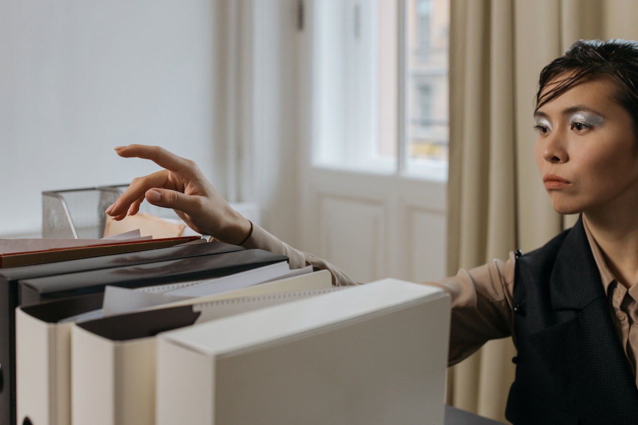 woman looking through legal records