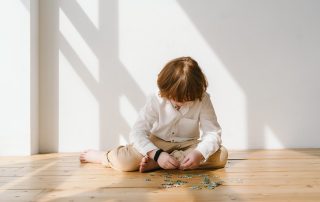 child building a puzzle