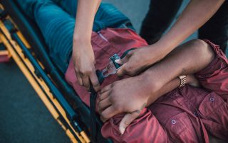 person lying on a stretcher